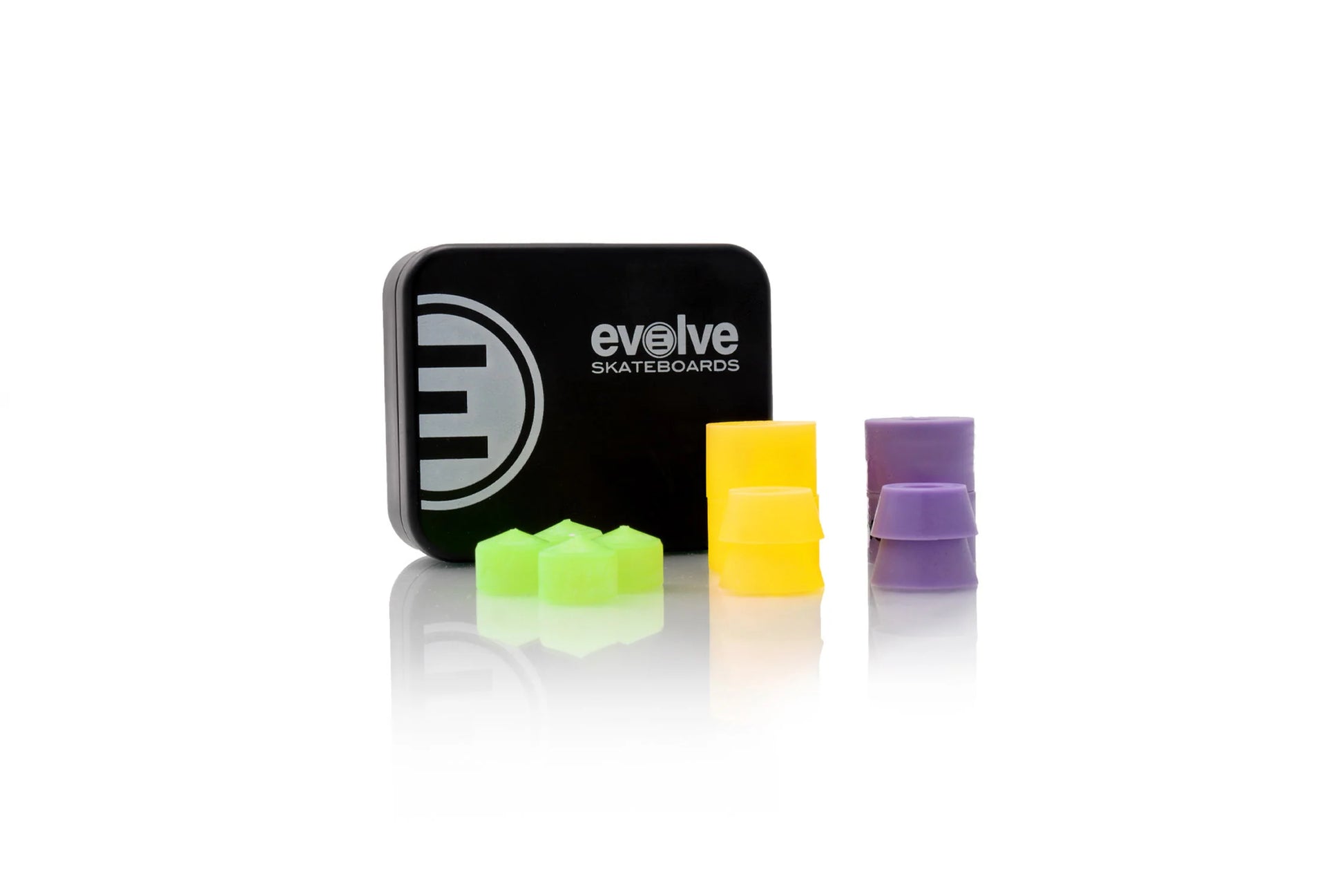 Evolve Skateboards bushings in green, yellow, and purple with branded case